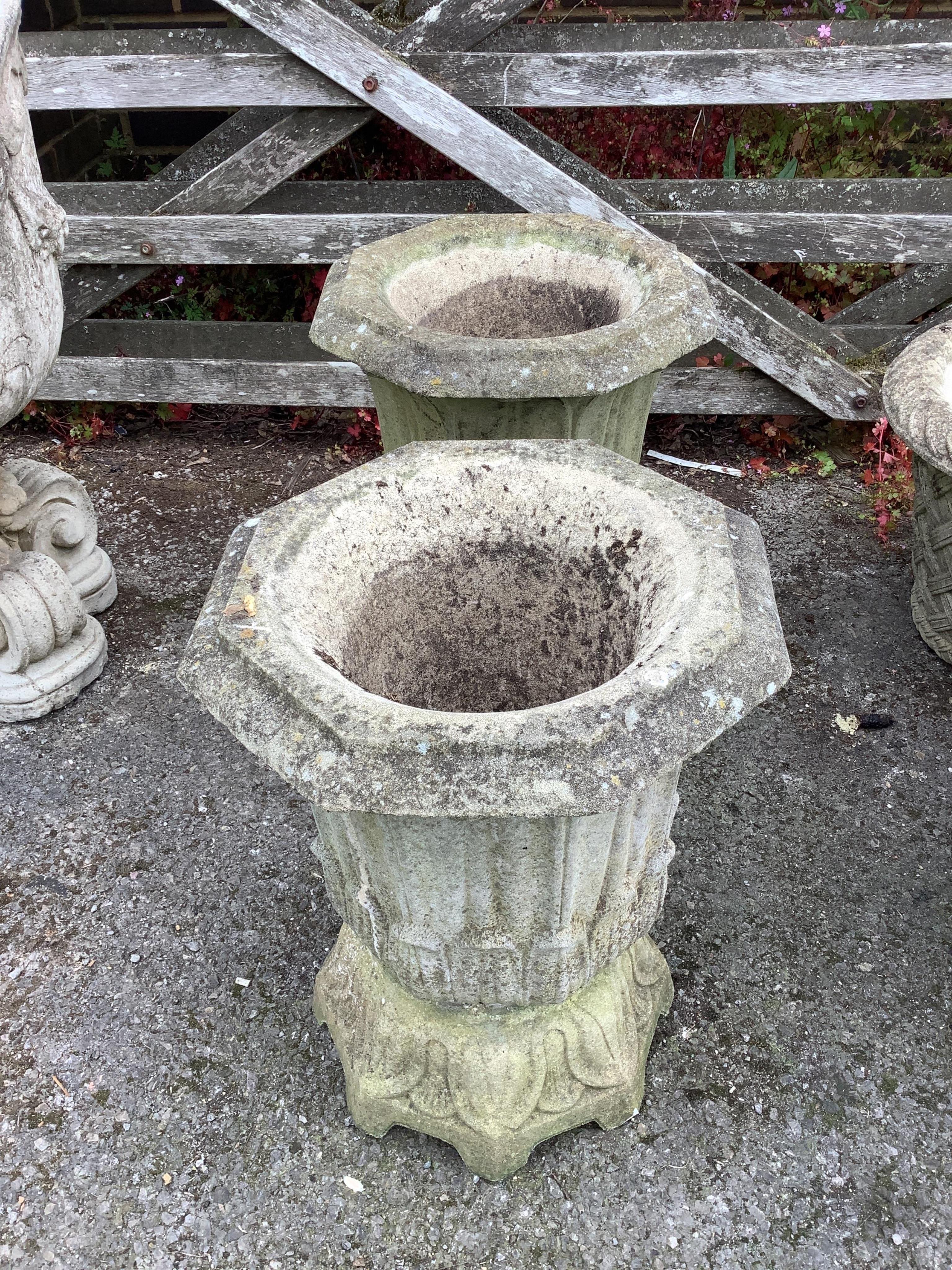 A pair of Haddonstone 'lotus' octagonal stone planters, width 40cm, height 50cm. Condition - fair